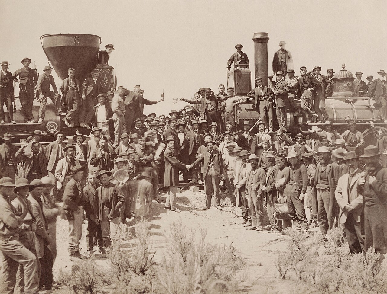 Photograph of the 1869 Golden Spike ceremony where Union Pacific and Central Pacific locomotives met